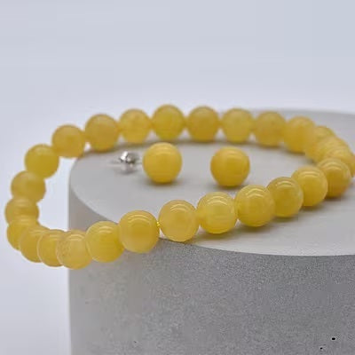A Yellow Jade Bracelet and Earring Set