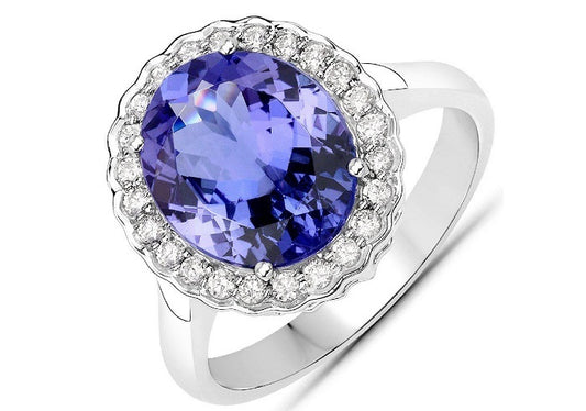 A 14K white gold halo ring featuring a large tanzanite stone and a halo of diamonds from Cooper Jewellery and Watches